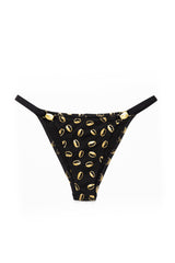 front view of ebony and ivory tanga underwear with gold cowrie shell print on white background